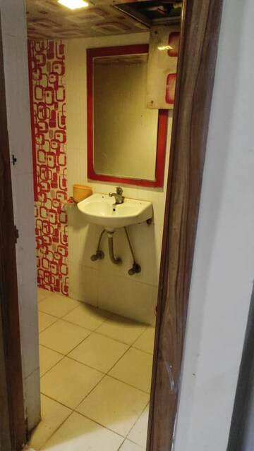 Bathroom in 1 BHK Apartment at Royal Palms Garden View, Goregaon East – for Rent