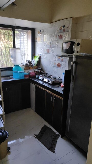 Kitchen in 1 BHK Apartment at Royal Palms Garden View, Goregaon East – for Rent