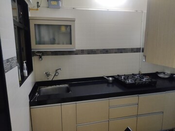 Kitchen in 2 BHK Apartment at Yashraj Park CHS, Kasarvadavali – for Rent