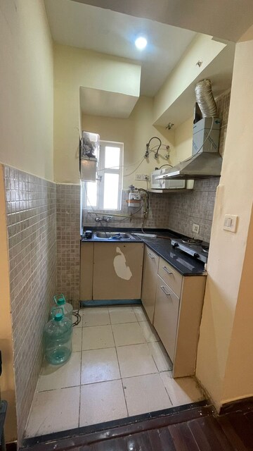 Kitchen in 1 BHK Apartment at Paras Tierea, Sector 137 – for Rent