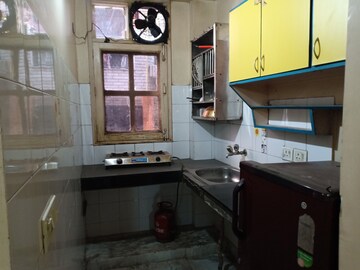Kitchen in 1.5 BHK Apartment at Khirki Extension – for Rent