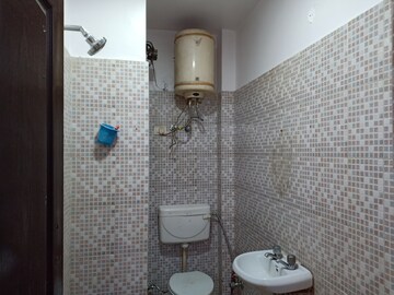Bathroom in 1.5 BHK Apartment at Khirki Extension – for Rent