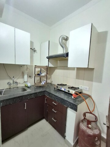Kitchen in Studio Apartment at Maya Garden City, Lohgarh – for Rent