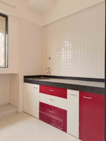 Kitchen in 1 BHK Apartment at Rustomjee Global City – for Sale