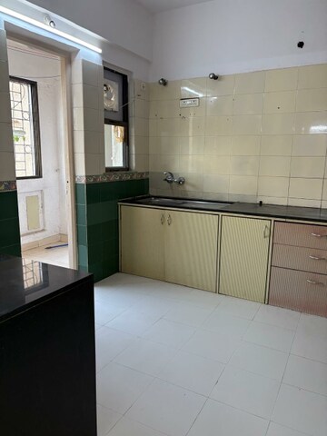 Kitchen in 3 BHK Apartment at NRI Complex Phase 2, Seawoods – for Rent