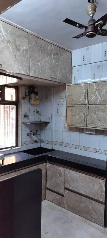 Kitchen in 1 BHK Apartment at Happy Home Complex, Mira Road – for Sale
