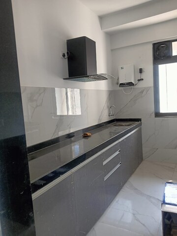 Kitchen in 2 BHK Apartment at Dev Leo Tower, Oshiwara – for Rent