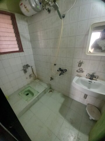 Bathroom in 3 BHK Apartment at Lokhandwala Whispering Palms, Kandivali East – for Rent