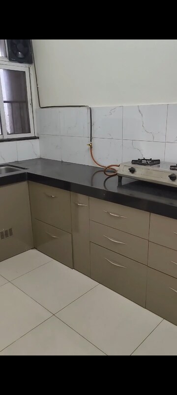 Kitchen in 2 BHK Apartment at Kolte Patil R10, Hinjewadi – for Rent