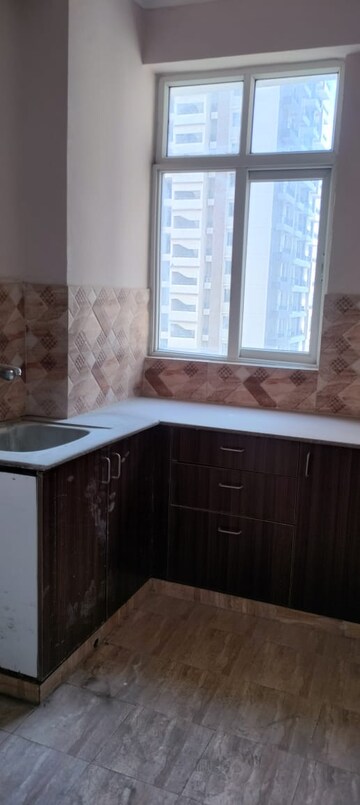 Kitchen in 3 BHK Apartment at Amrapali Golf Homes, Sector 4, Greater Noida – for Sale