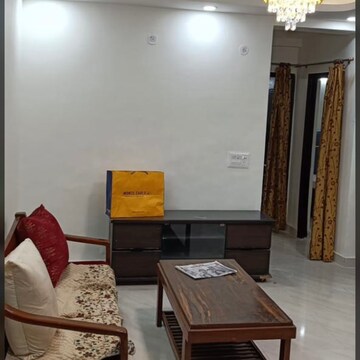 Living Room in 2 BHK Apartment at Aims Golf City, Noida Central – for Rent
