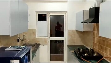 Kitchen in 2 BHK Apartment at Aims Golf City, Sector 75 – for Rent