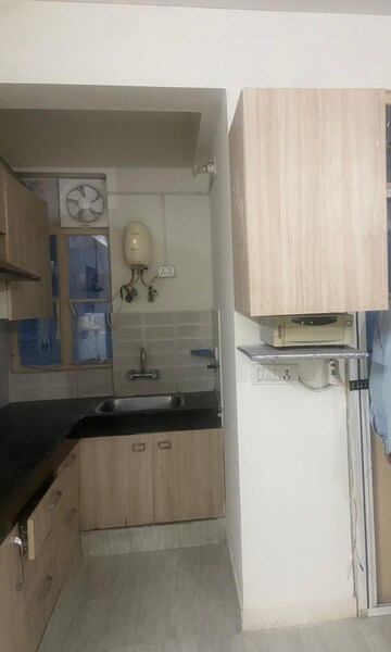 Kitchen in 1.5 BHK Apartment at Signature Global Solera 2, Sector 107 – for Rent