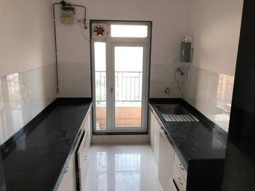 Kitchen in 2 BHK Apartment at Rustomjee Urbania, Majiwada – for Sale