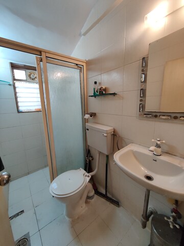 Bathroom in 1 BHK Apartment at Firdaus CHS, Bandra West – for Rent