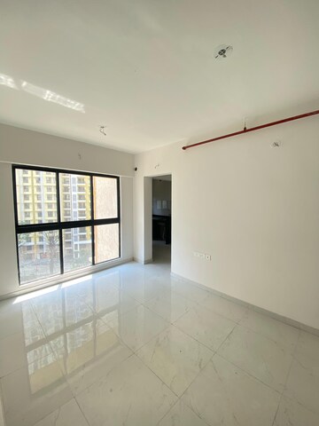 Living Room in 1 BHK Apartment at Runwal Gardens, Dombivli East – for Rent