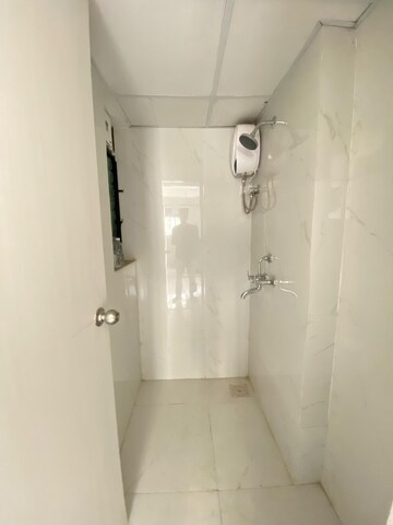 Bathroom in 1 BHK Apartment at Runwal Gardens, Dombivli East – for Rent