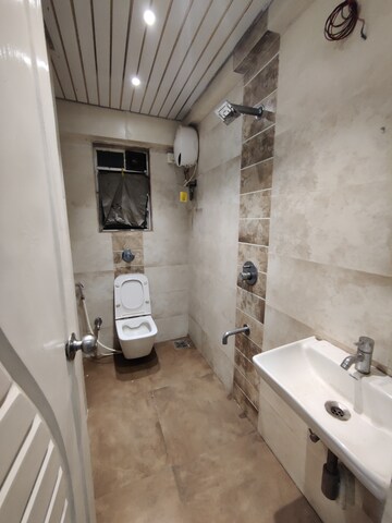 Bathroom in 1 BHK Apartment at Mohini Castle, Khar West – for Rent