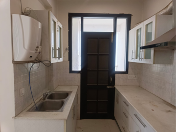 Kitchen in 2 BHK Apartment at Golden Sand Apartments, Dhakoli Village – for Sale