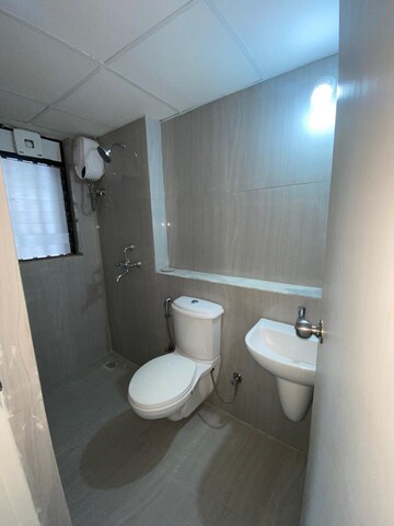 Bathroom in 1 BHK Apartment at Runwal Gardens Phase I, Dombivli East – for Rent