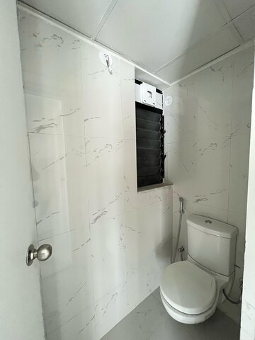 Bathroom in 1 BHK Apartment at Runwal Gardens, Dombivli East – for Rent