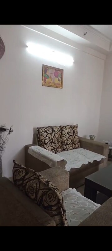 Living Room in 2 BHK Apartment at Amrapali Golf Homes, Sector 4, Greater Noida – for Sale