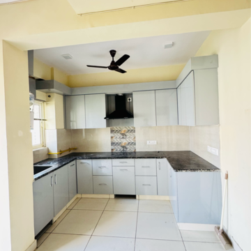 Kitchen in 3.5 BHK Apartment at Aims Golf City, Noida Central – for Rent