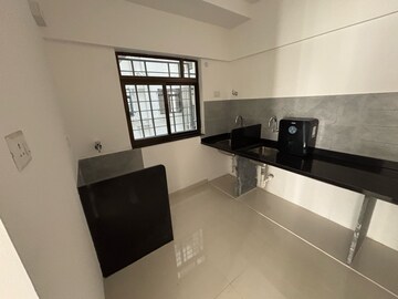 Kitchen in 2 BHK Apartment at Roshan Milestone, Tathawade – for Rent