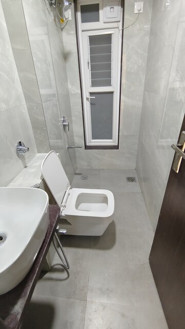 Bathroom in 2 BHK Apartment at Prime CHS, Mulund East – for Rent