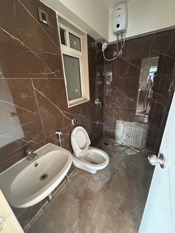 Bathroom in 4 BHK Apartment at Alag Aranya, Naidu Colony – for Rent