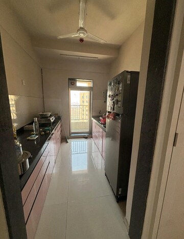 Kitchen in 2 BHK Apartment at Rustomjee Urbania Azziano, Majiwada – for Rent