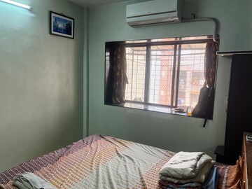 Bedroom in 1 BHK Apartment at Trimurti Krupa CHS, Borivali West – for Sale