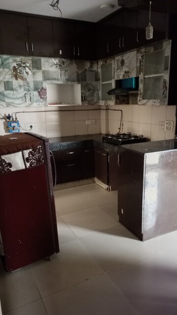Kitchen in 2 BHK Apartment at Exotica Dreamville, Sector 16c Greater Noida – for Rent