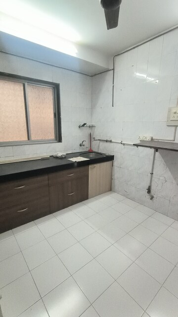 Kitchen in 2 BHK Apartment at Govardhan Baug Apartment, Matunga West – for Sale