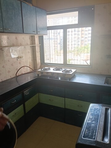 Kitchen in 1 BHK Apartment at Preeti Sagar CHS, Borivali West – for Rent