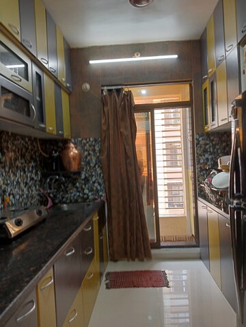 Living Room in 2 BHK Apartment at Ajmera Yogi Dham Phase III, Kalyan West – for Rent