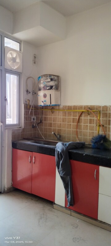 Kitchen in 3 BHK Apartment at Mahagun Mywoods, Sector 16c Greater Noida – for Rent
