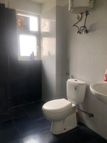 Bathroom in 5 BHK Apartment at Mahagun Moderne, Sector 78 – for Rent