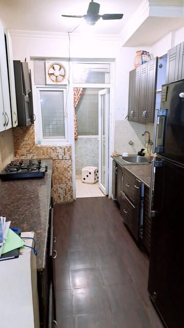 Kitchen in 3 BHK Apartment at Amrapali Silicon City, Sector 76 – for Rent
