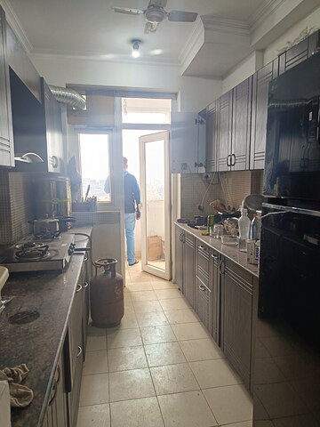 Kitchen in 3 BHK Apartment at Amrapali Silicon City, Sector 76 – for Rent