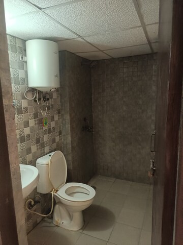 Bathroom in 2 BHK Apartment at Aims Golf City, Sector 75 – for Rent