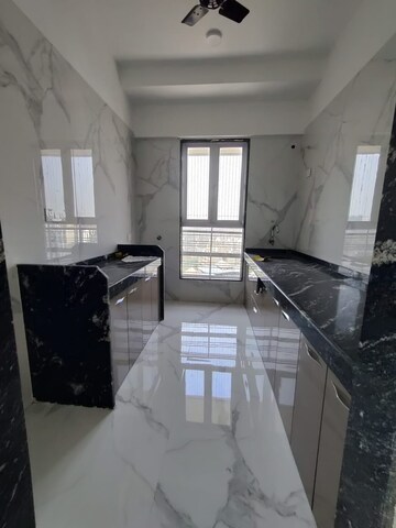 Kitchen in 2 BHK Apartment at Pramanik Walchand Paradise, Mira Road – for Rent