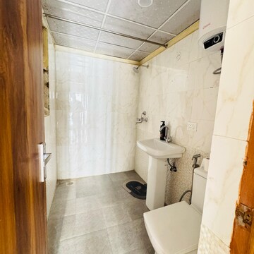 Bathroom in 3 BHK Apartment at Gardenia Golf City, Noida Central – for Rent