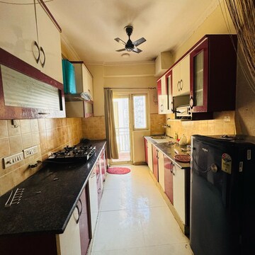 Kitchen in 2 BHK Apartment at Gardenia Golf City, Noida Central – for Rent