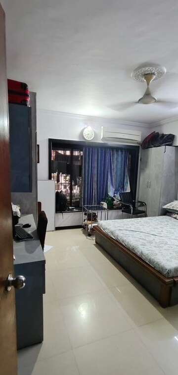 Living Room in 2 BHK Apartment at Ratna Samuha CHS, Andheri West – for Rent