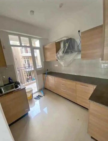 Kitchen in 3 BHK Apartment at ATS Happy Trails, Sector 10 Greater Noida – for Rent
