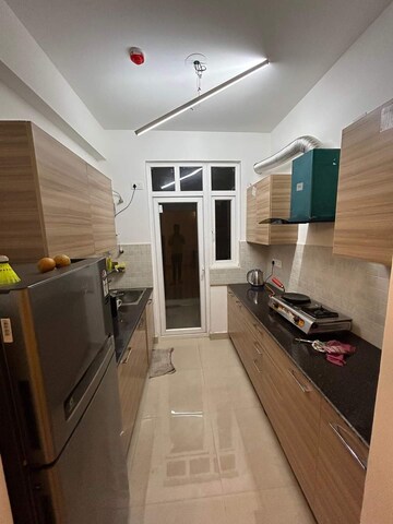 Kitchen in 3 BHK Apartment at ATS Happy Trails, Sector 10 Greater Noida – for Rent