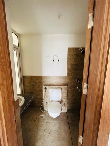 Bathroom in 3 BHK Apartment at ATS Happy Trails, Sector 10 Greater Noida – for Rent