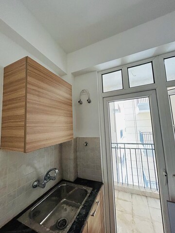 Kitchen in 3 BHK Apartment at ATS Happy Trails, Sector 10 Greater Noida – for Rent