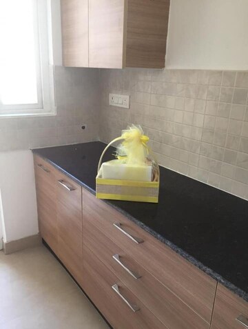 Kitchen in 3 BHK Apartment at ATS Happy Trails, Sector 10 Greater Noida – for Rent